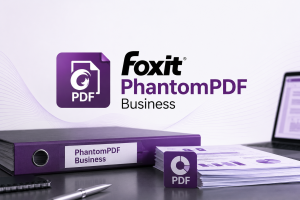 Foxit PhantomPDF Business PDF software branding with a purple PDF icon, business document binder, paperwork, and laptop.